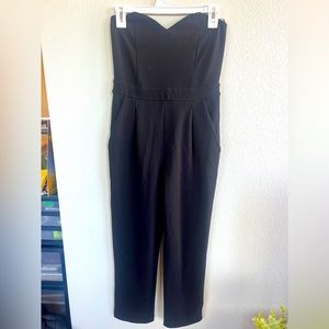 Black sleeveless pants suit